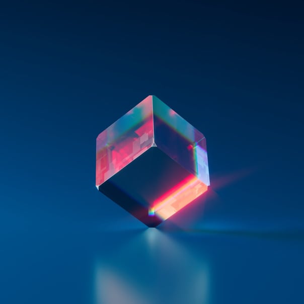 a transluscent crystal-looking cube standing on one of it's corner against a navy blue background